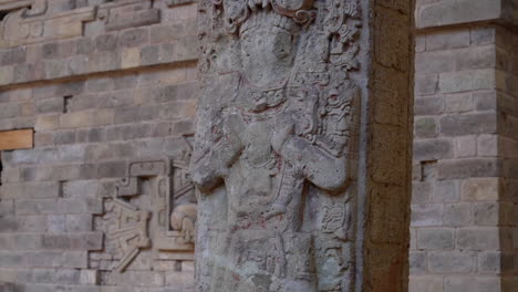 tilt down movement over a antique mayan monolith at copan