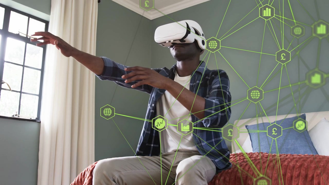Mand med VR-headset sidder på sengen og bruger håndbevægelser til at analysere finansdiagrammer.