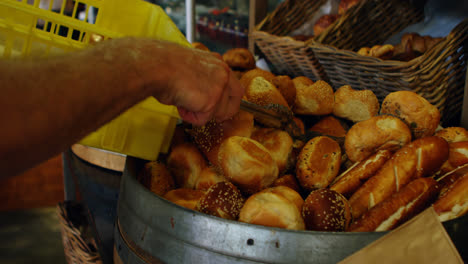 male chef putting bread in basket 4k