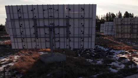 drone view solar panel from behind revealing several more