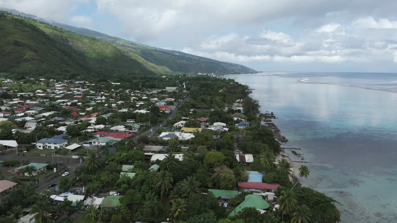 A Town With Tropical Nature At Plage Vaiava Beach In Puna'auia, French Polynesia. Aerial Drone Shot