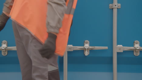 worker opening a shipping container