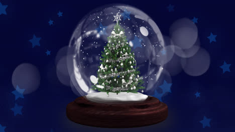 Shooting-star-over-christmas-tree-in-a-snow-globe-against-multiple-blue-stars-icons-floating