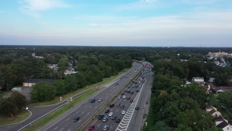 an aerial view next to a busy parkway in the evening during rush hour