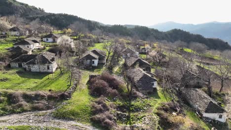 small rural village houses situated on mountainside with stony roofs