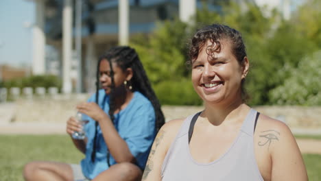 static shot of happy woman smiling at camera after training