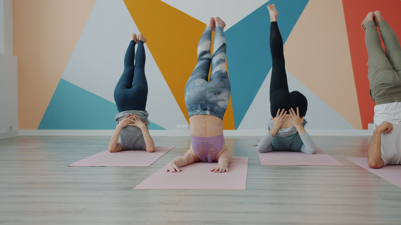 Group headstand yoga practice