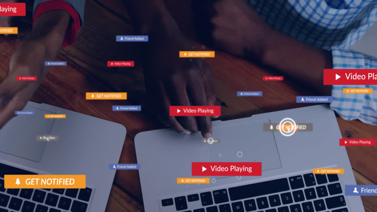 Animation of social media icons against mid section of colleagues discussing over laptop at office