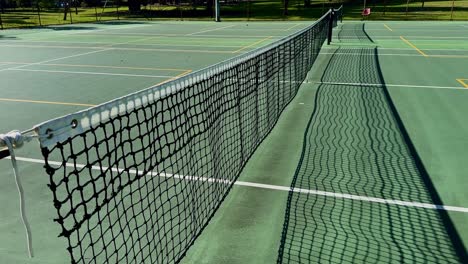 tennis court closeup net down line of multiple courts perth australia