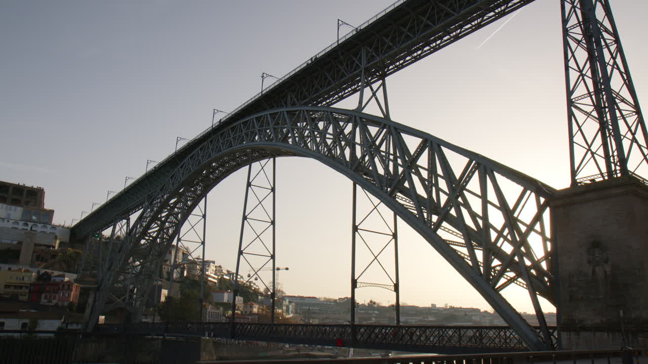 Iron bridge of Dom Luis I in Porto at sunset. Low angle view