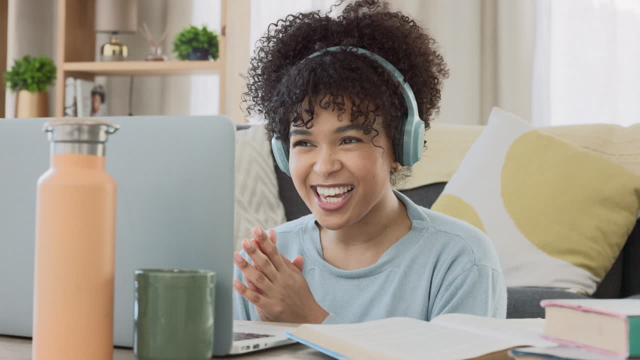 Cheerful online tutor clapping her hands to