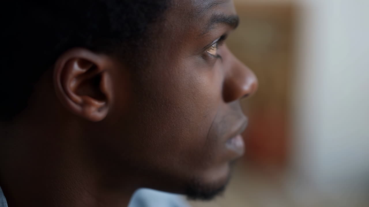 Close-up Profile of a Thoughtful Young Black Man