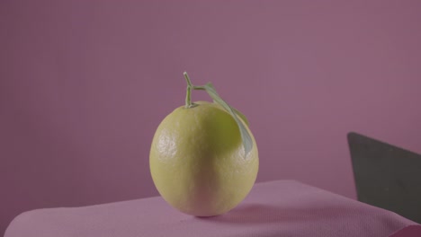 lemon rotating with loop on fuchsia screen for chroma key