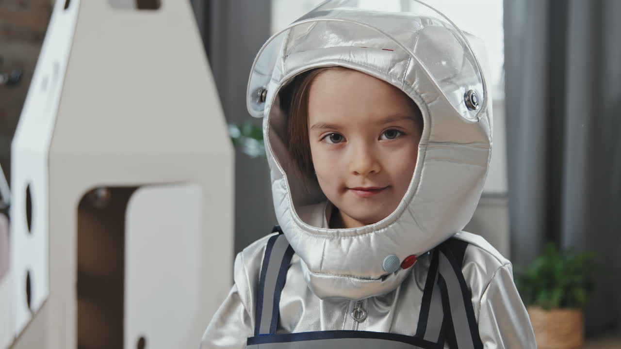 Little Girl in Spacesuit Looking at Camera