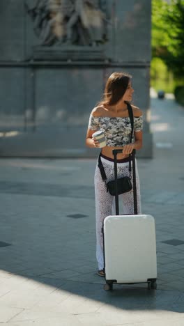 woman with a suitcase in a city