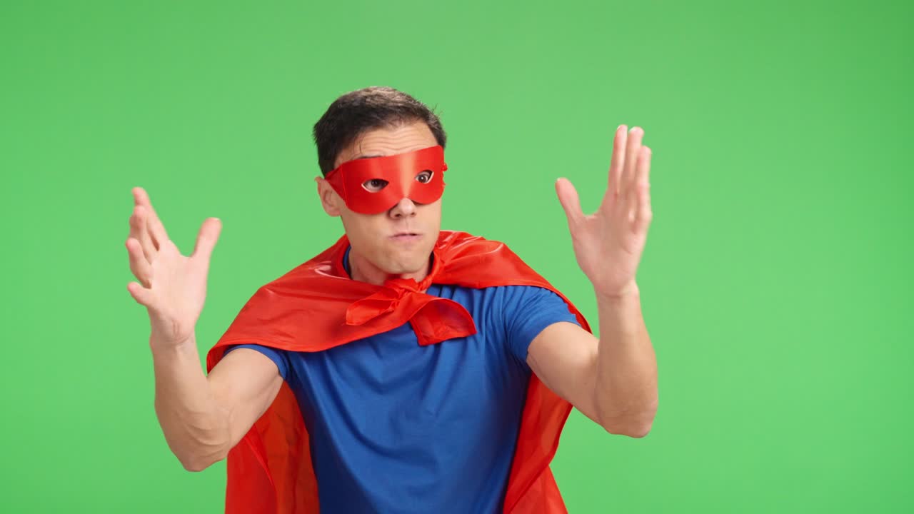 Superhero suffering defeat on green screen