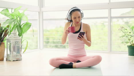 Coffee,-phone-and-woman-with-headphones-on-yoga