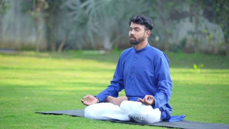 indian man doing pranayam exercise