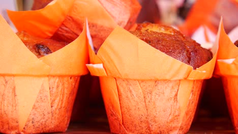 close-up of delicious muffins in orange liners