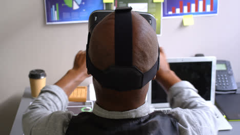 businessman using virtual reality headset on desk in the office 4k