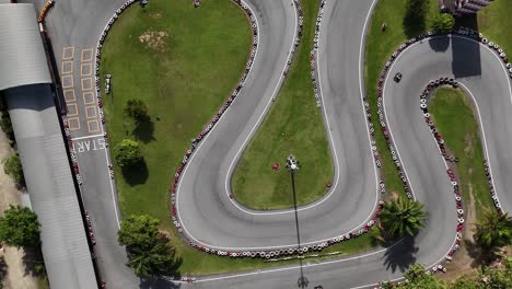 overhead view of a go-kart track with tire barriers