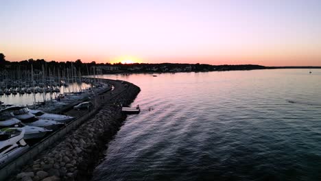 Swimmers-swimming-off-platform-in-Sunset