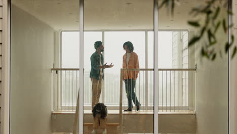 couple walking up the stairs of their modern home