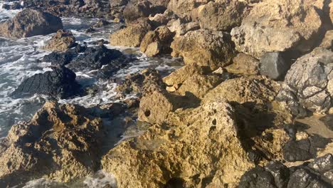 sea hitting on rock in paphos, cyprus