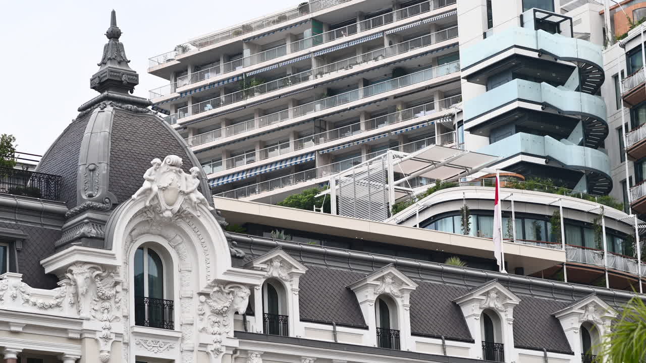 Buildings in Monte Carlo district downtown with green palm trees, Monaco