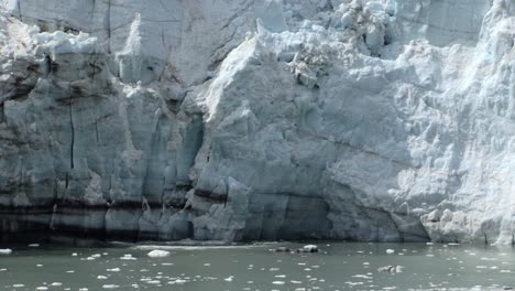 small pieces of ice falling from margerie glacier