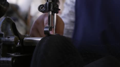 mixed race woman working at a hat factory