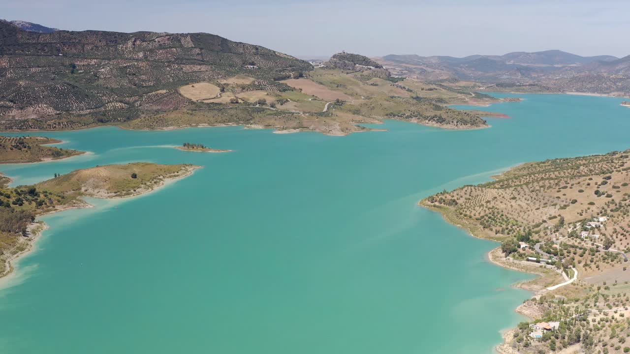 Aerial View of a Turquoise Reservoir in the Spanish Mountains