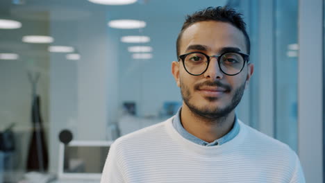 portrait of a young professional in an office