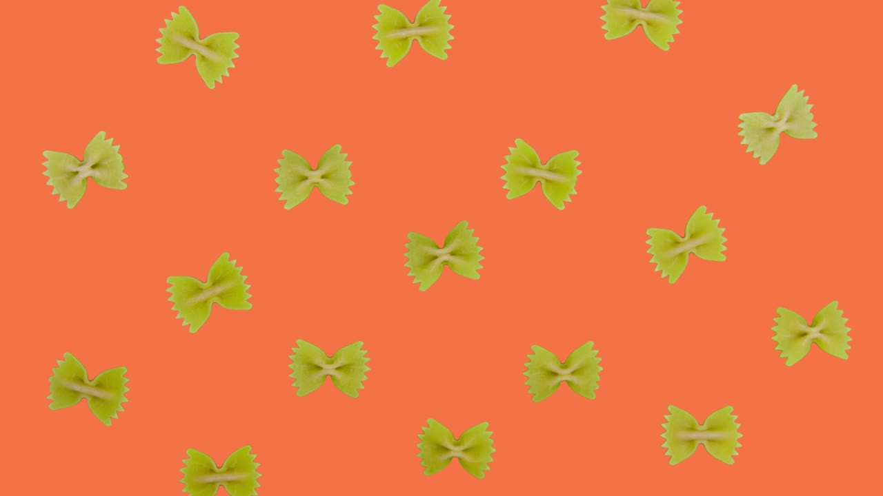 parada de movimiento animado farfalle de pasta en el fondo de la pantalla verde. vista superior de cerca de fondo de comida