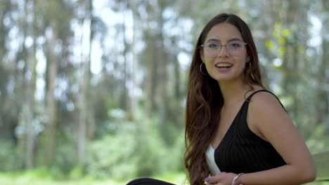 engaging ecuadorian woman in stylish black and white attire, sporting glasses