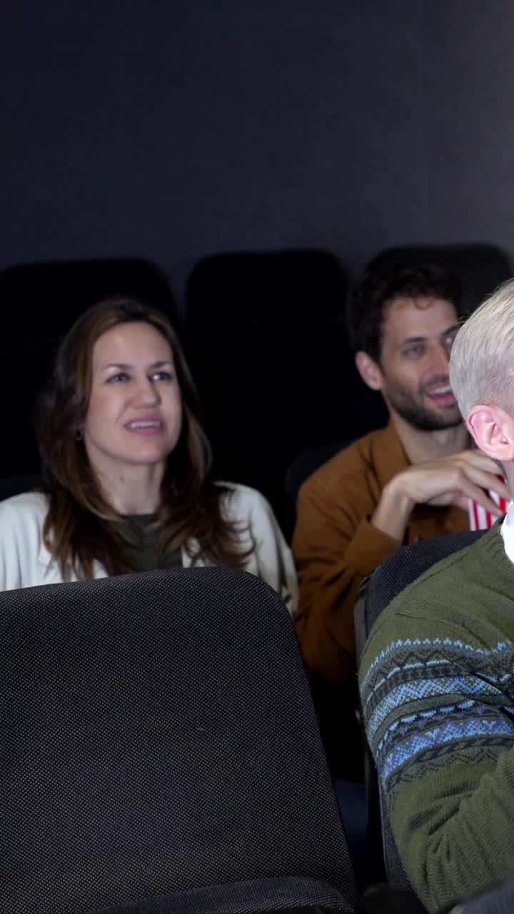 People watching a movie in a theater
