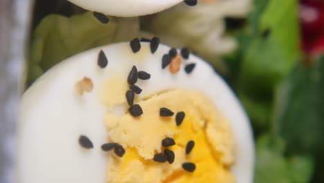 close-up of a sliced egg in a salad