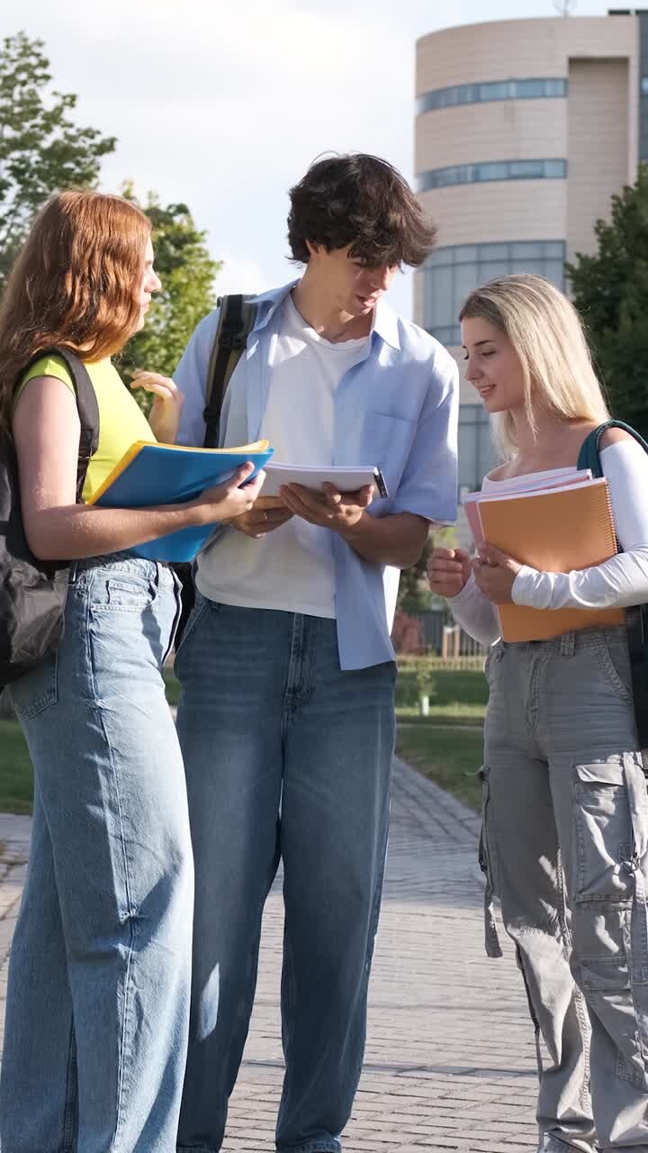 Engaging students walking and discussing schoolwork on a sunny campus