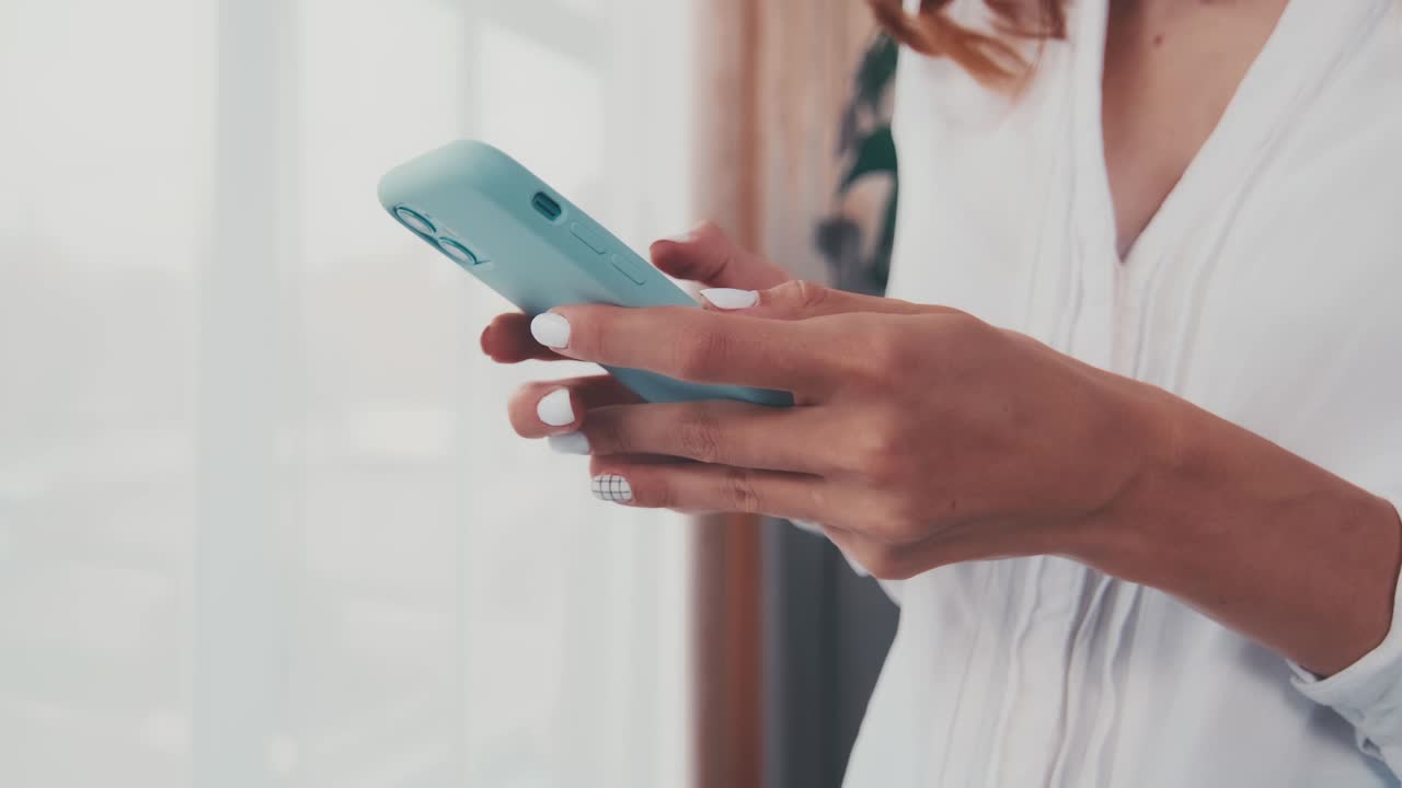 Close up of female hands user browse web on modern smartphone gadget