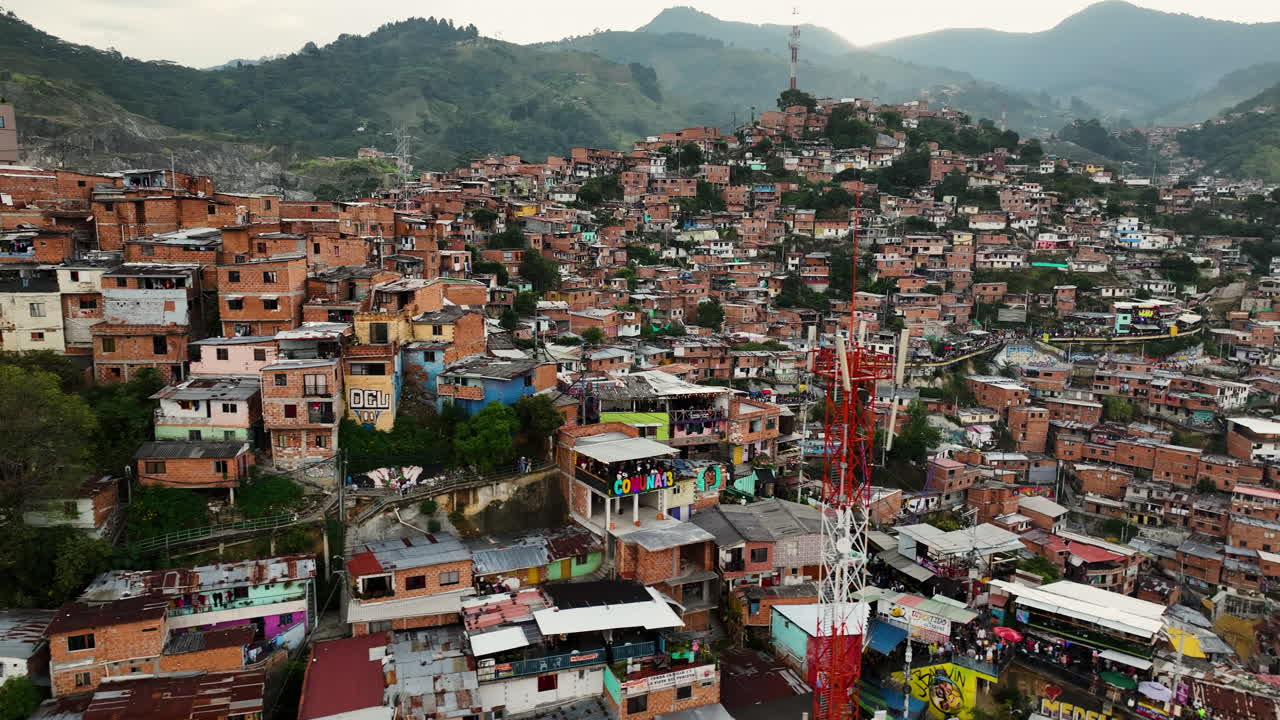 Drone shot in front of a poor community homes in Comuna 13, in Medell&iacute;n, Colombia