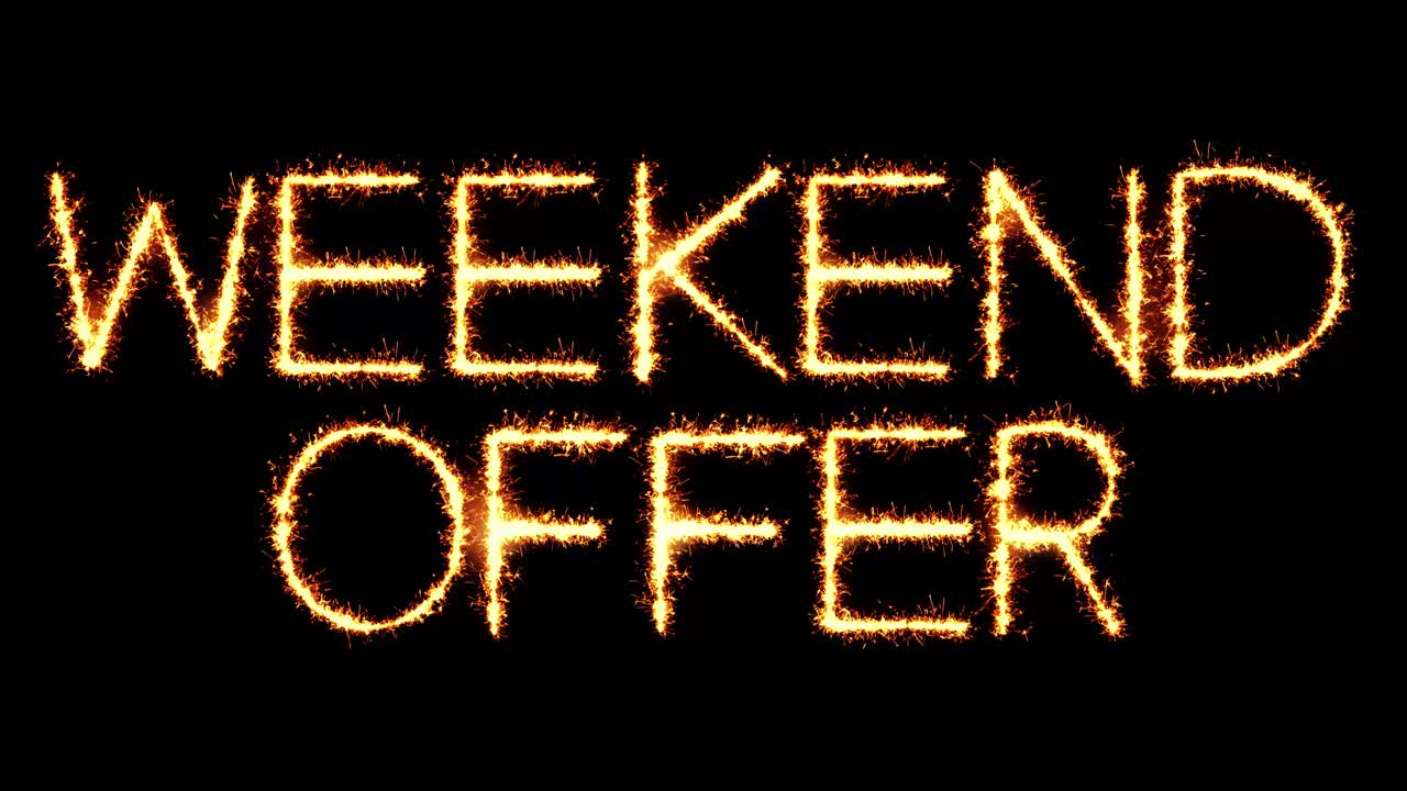 Weekend offer text sparkler writing with glitter sparks particles firework on black 4k loop