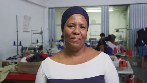 front view of mixed race worker in factory