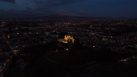 aerial-view-of-cholula-pyramid-and-church-at-night