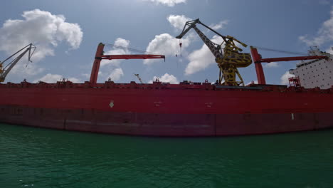 A-seagoing-vessel-is-moored-at-the-quay,-view-from-the-water