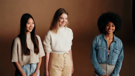 three young women in a studio setting