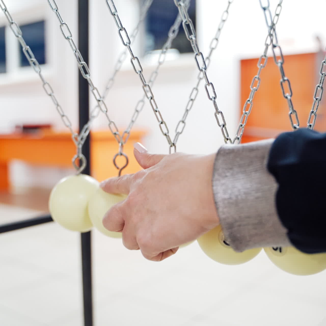 Newton's cradle showing laws of physics in motion. Museum of Science and newton pendulum