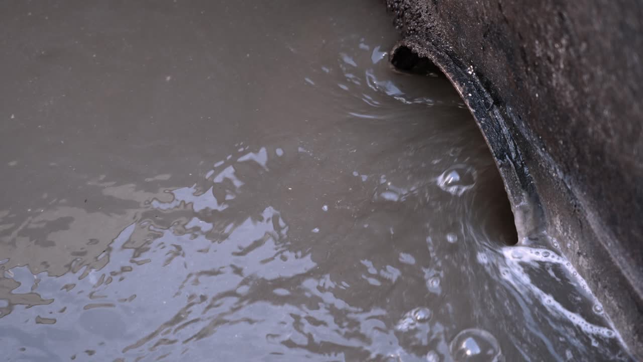 Close-Up of Wastewater Flow: A Symbol of Purification
