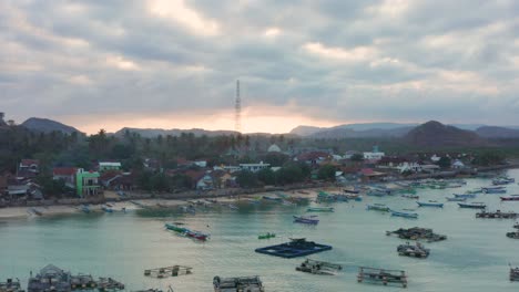 Sunset-at-the-bay-of-the-fishing-village-of-Gerupuk,-Lombok