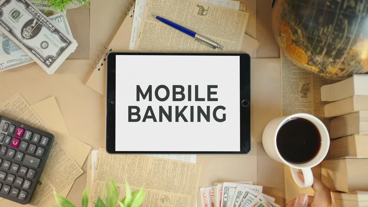 MOBILE BANKING DISPLAYING ON FINANCE TABLET SCREEN