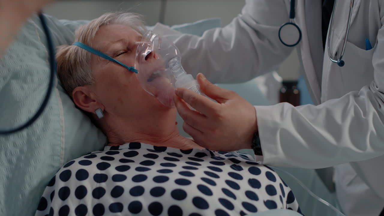 Close up of doctor putting oxygen mask on patient with disease
